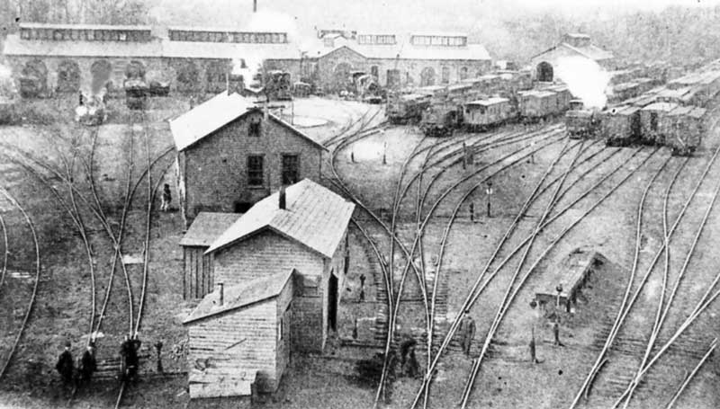 Repair shop for locomotives and rail cars on the New York, Susquehanna and Western Railroads, circa 1900.